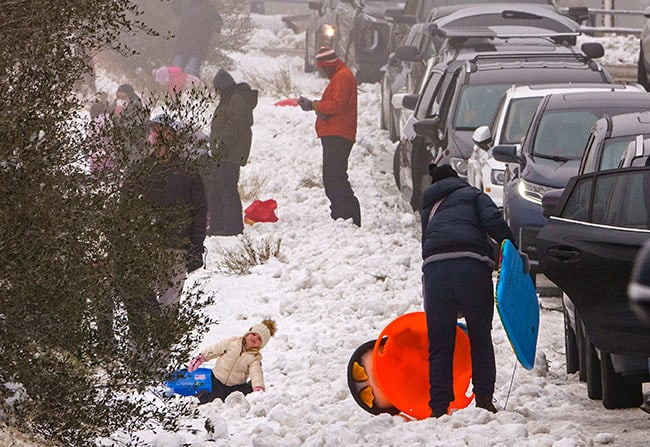 Rain and snow arrive, skies clearing Friday